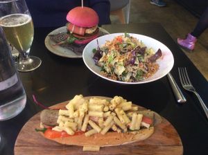 The chin salad, hot dog with Mac n cheese  and a burger in a pink bun! All very tasty. at Unity Diner in East London
