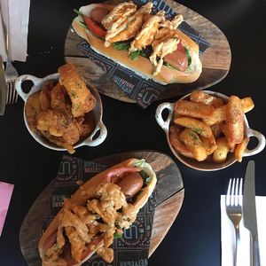 Surf N Turf Dogs with onion rings and chunky chips at Unity Diner in East London