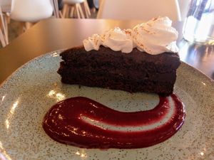 Chocolate cake. I think it was okay but nothing like the baked cheesecake.  at Unity Diner in East London