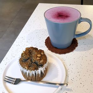 Vegan, gluten-free muffin (black sesame flavor) and vegan purple sweet potato latte. at Alfreebe - 알프리베 in Goyang