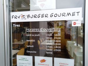 Opening Times and dining room at the front. at Fryburger Gourmet in Bulle