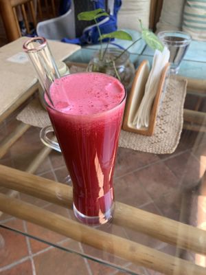 Apple, beetroot, and carrot juice with glass straw!  at Ananda Tree House in Kathmandu