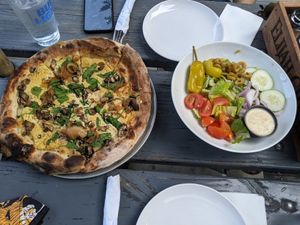 Vegan white portabello pizza with vegan Greek salad at Firepit in Atlanta