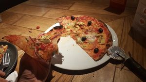 Artichoke, red onion and black olives, with tomato, vegan mozzarella alternative, garlic oil and parsley at Pizza Express - Greenwich Church St in South East London
