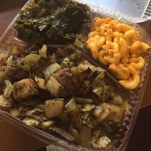 Jerk ";chicken"; over rice with Mac n cheese and collards  at Senbeb Cafe in Washington