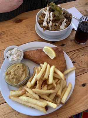 Vish and chips with tartare sauce and curry sauce. And kebab loaded chips. Both lovely!   at Pyramid Vegan Cafe & Bakery in Glastonbury
