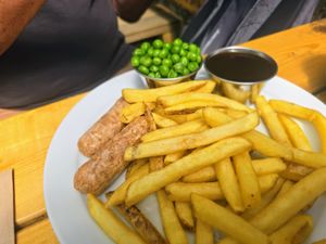 Sausage, chips, peas & gravy at Pyramid Vegan Cafe & Bakery in Glastonbury