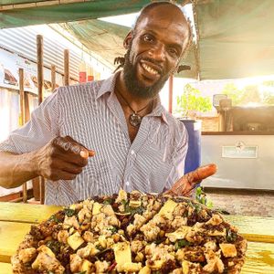 Steven (owner/chef) with his gourmet pizza at Lion's Share Cafe in Bridgetown