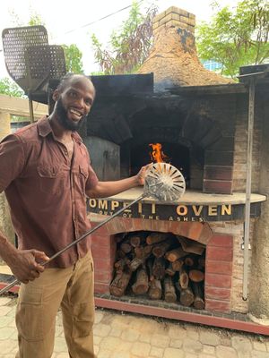 Steven and his oven at Lion's Share Cafe in Bridgetown