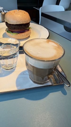 Oat latte with felafel burger in the backgroundd  at HKG - Beef & Liberty Burgers - T1 in Outlying Islands
