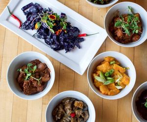 Red cabbage, okra, squash, eggplant, mushroom dishes at Selam Vegan Restaurant in Toronto