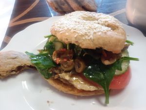 Vegan Veggie sandwich on a vegan sesame bagel. Plus vegan chocolate chip cookies and hot cocoa with almond milk at Epiphany in Naples