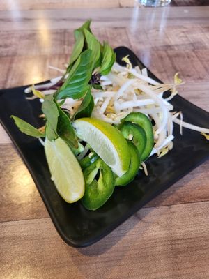 Bean sprouts, jalapeños, Thai basil, and limes for the pho at Pho Van in Pittsburgh
