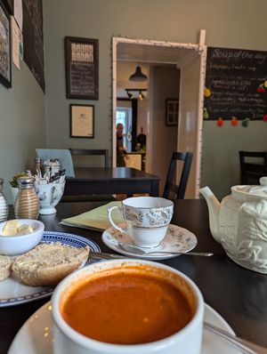 Cherry tea with red pepper and tomato soup, and bread role with vegan spread. at The Herb Garden in Buxton