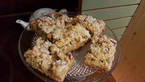 A slice of homemade vegan rhubarb crumble cake at The Herb Garden in Buxton