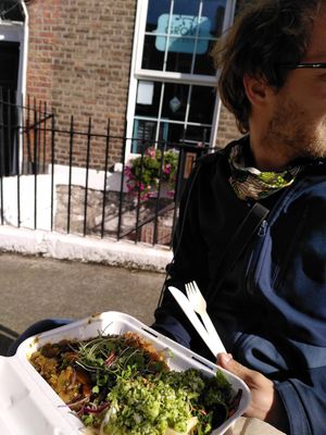 Outdoor sitting area for 6 people, here with the curry and buckwheat with 3 salads at The Grove Veggie Kitchen in Limerick