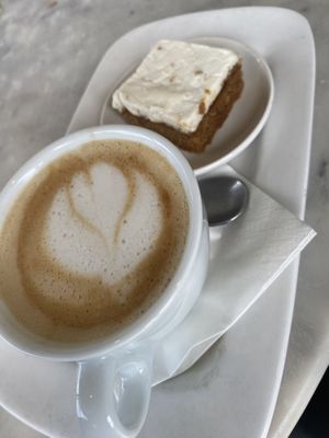 Oat latte with stem ginger cake  at Pizza Express in Newark