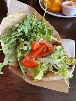 Vegan Gyros in Pita Bread with Tzatiki, in the back Schnitzel with Cheeese  at Apple & Eve in Hamburg