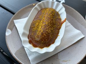 Curry Wurst in curry sauce  at Apple & Eve in Hamburg