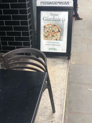 sandwich board outside  at Pizza Express - Notting Hill Gate in West London