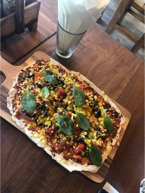 Pizza with cheese vegan at The Vegan Table in Phuket