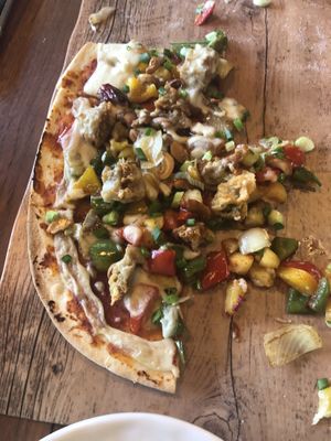 Forgot to take a pic until half eaten! Fried chicken pizza  at The Vegan Table in Phuket