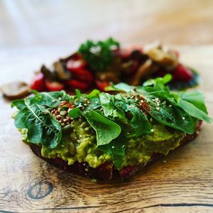 Avocado 🥑 toast on amazing sourdough bread with beetroot humus and rocket salad 🥗  at The Vegan Table in Phuket