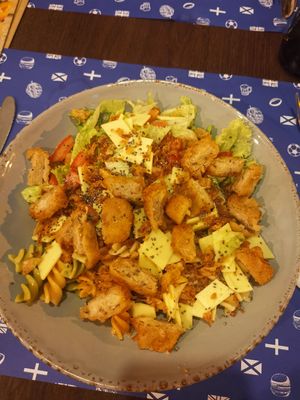 Salad with vegan cheese and a patty at Iron Duke in Aveiro