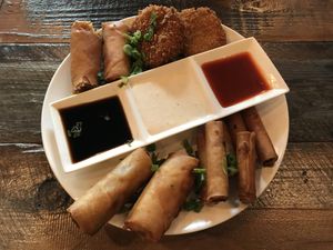 love this! veggie lumpia, “crab" cakes, lumpia shanghai at Nick's on Grand in South San Francisco