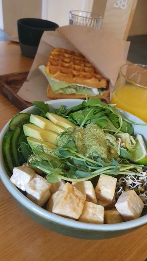 Green bowl and waffle sandwich at Fika in St Petersburg