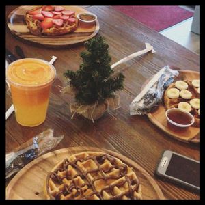 Vegetarian protein waffles with orange,carrot, cantaloupe and ginger juice! at Rhythm & Beets Juice Cafe in New York City