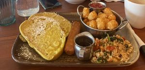 Big breakfast with vegan French toast, beyond sausage, tofu scramble and tots    at Namo Cafe Bistro in Calgary