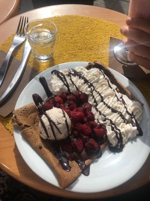 vegan crêpe with whipped cream, chocolat sauce, raspberries and  ice cream at Coffee Crepes in Paris