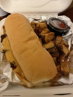 Mushroom philly take out with home fries at Irregardless Cafe in Raleigh