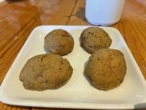 Complimentary scones… not very scone-like but vegan and complimentary so not gonna complain    at Irregardless Cafe in Raleigh