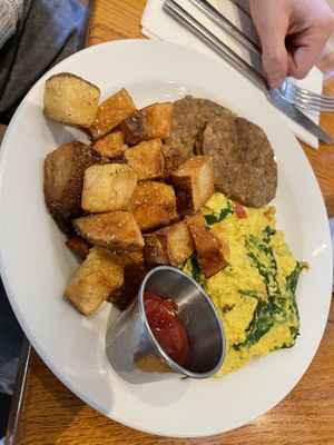 Tofu soup, err, I mean scramble. 😔 home fries were good, veggie sausage bland    at Irregardless Cafe in Raleigh