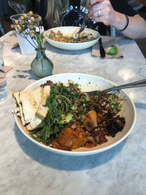 Foreground: Mother Earth bowl (vegan). Background: Glow bowl (vegan)  at Flower Child in Atlanta
