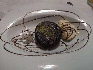 Vegan hot chocolate cake with ice cream and cream at Ristorante Gourmet in Elche