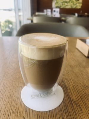 Oat milk latte  at Eat Well Restaurant in Dubai