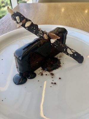 Dark chocolate cake  at Eat Well Restaurant in Dubai