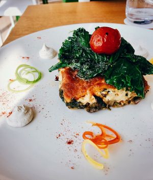 Part of the business menu of the day: polenta with cashew’s cream cheeze, mushrooms and sautéed kale.  at Eat Well Restaurant in Dubai