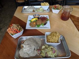 We got the June Bug plate: chicken fried steak, macaroni n cheese, potato salad, kale salad, and crab cakes. at V-Grits and Chimera Brewing in Louisville