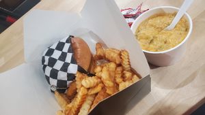 Brunch burger with fries and a side of cheesy grits at V-Grits and Chimera Brewing in Louisville