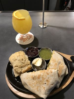 Brunchwrap supreme with biscuit and mimosa at V-Grits and Chimera Brewing in Louisville
