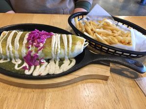 Wrap filled with fajita-style seitan and covered with salsa verde at V-Grits and Chimera Brewing in Louisville