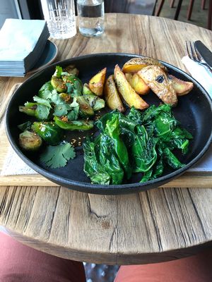 Grilled potatoes with spinach and Brussels sprouts at Ugolek in Moscow