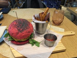 Holi burger (chickpea and quinoa burger) with sweet potato fries + beet ketchup at Veganapati in Lisbon