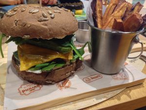 Brownie burger with sweet potato fries and beetroot ketchup at Veganapati in Lisbon