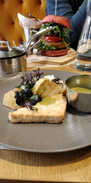 Tofu with curry -  chickpea burger on the back at Veganapati in Lisbon