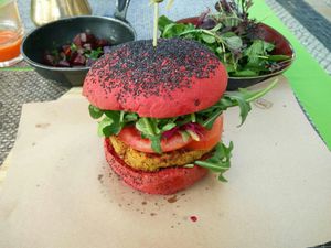 Holi burger with side salad and roasted beets at Veganapati in Lisbon